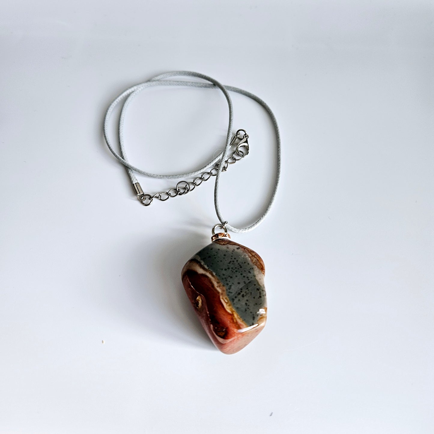 AMAZING DESERT JASPER PENDANT with extremely intricate color patterns and details! This is a very intricate and mesmerizing piece, featuring amazing color patterns and design. The shape is also super unique and will definitely stand out in the crowd!