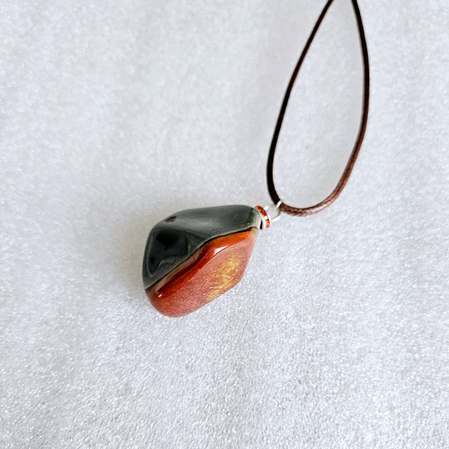 BEAUTIFUL POLYCHROME JASPER PENDANT WITH A STUNNING ARRAY OF COLOR PATTERNS.