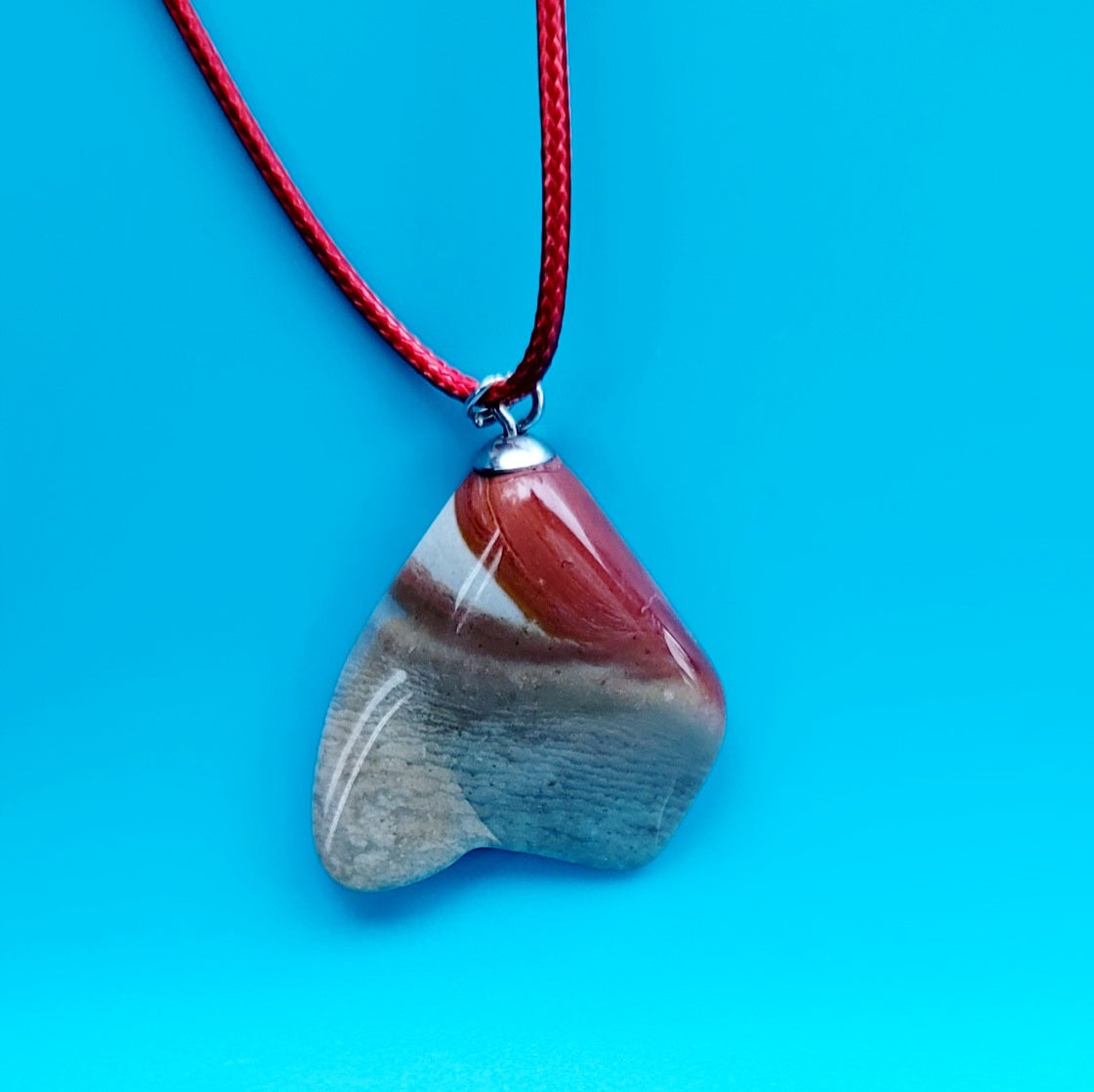 A Desert Jasper Pendant with an intricate color pattern that is sure to entice you! This is such a unique and interesting Pendant that it is sure to entice you! Explore its details and features and enjoy!!