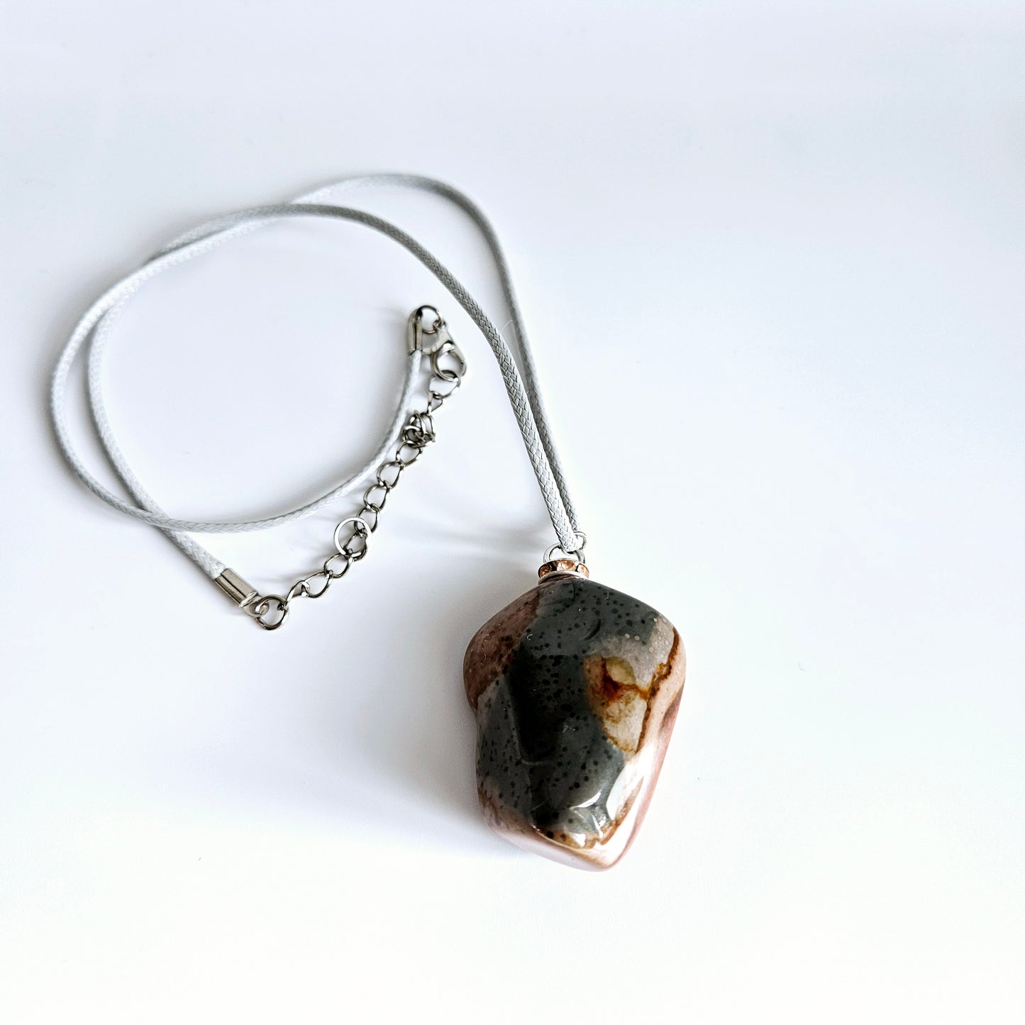 AMAZING DESERT JASPER PENDANT with extremely intricate color patterns and details! This is a very intricate and mesmerizing piece, featuring amazing color patterns and design. The shape is also super unique and will definitely stand out in the crowd!