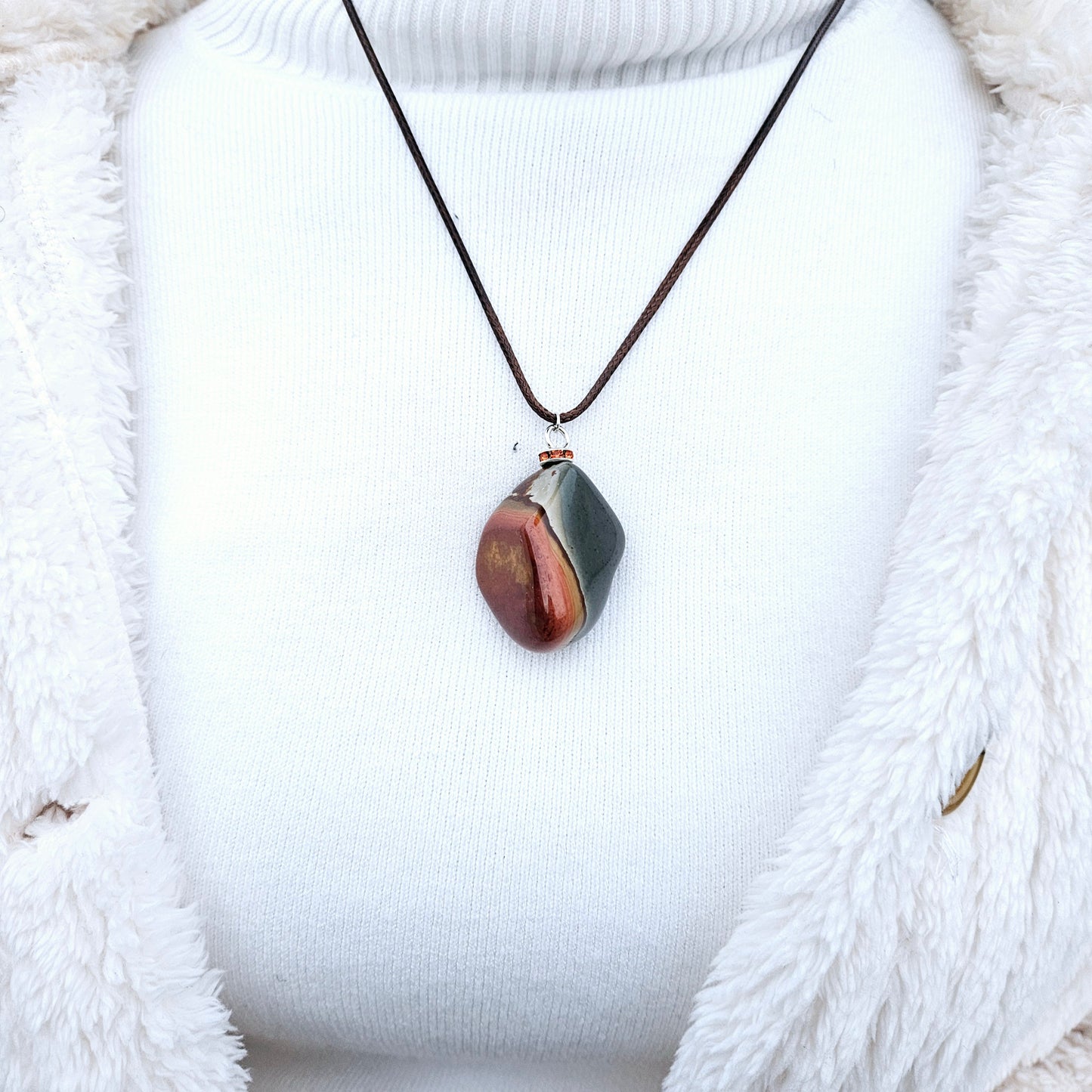 BEAUTIFUL POLYCHROME JASPER PENDANT WITH A STUNNING ARRAY OF COLOR PATTERNS.