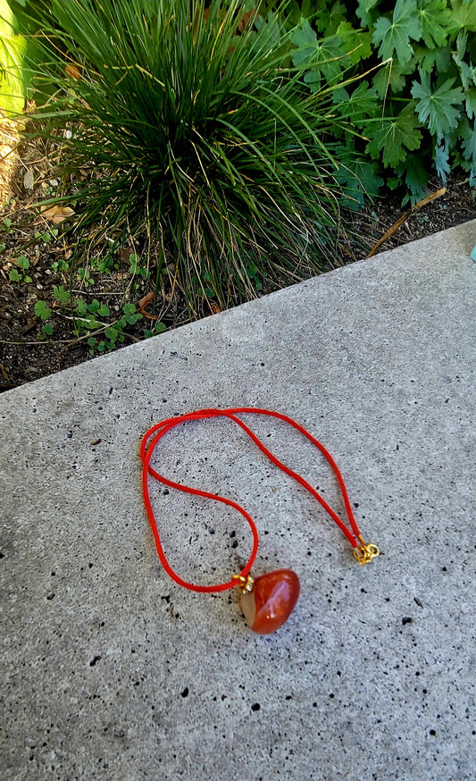 THIS INTRIGUING CARNELIAN AGATE PENDANT WILL FILL YOU WITH CURIOUSITY AND AWE.