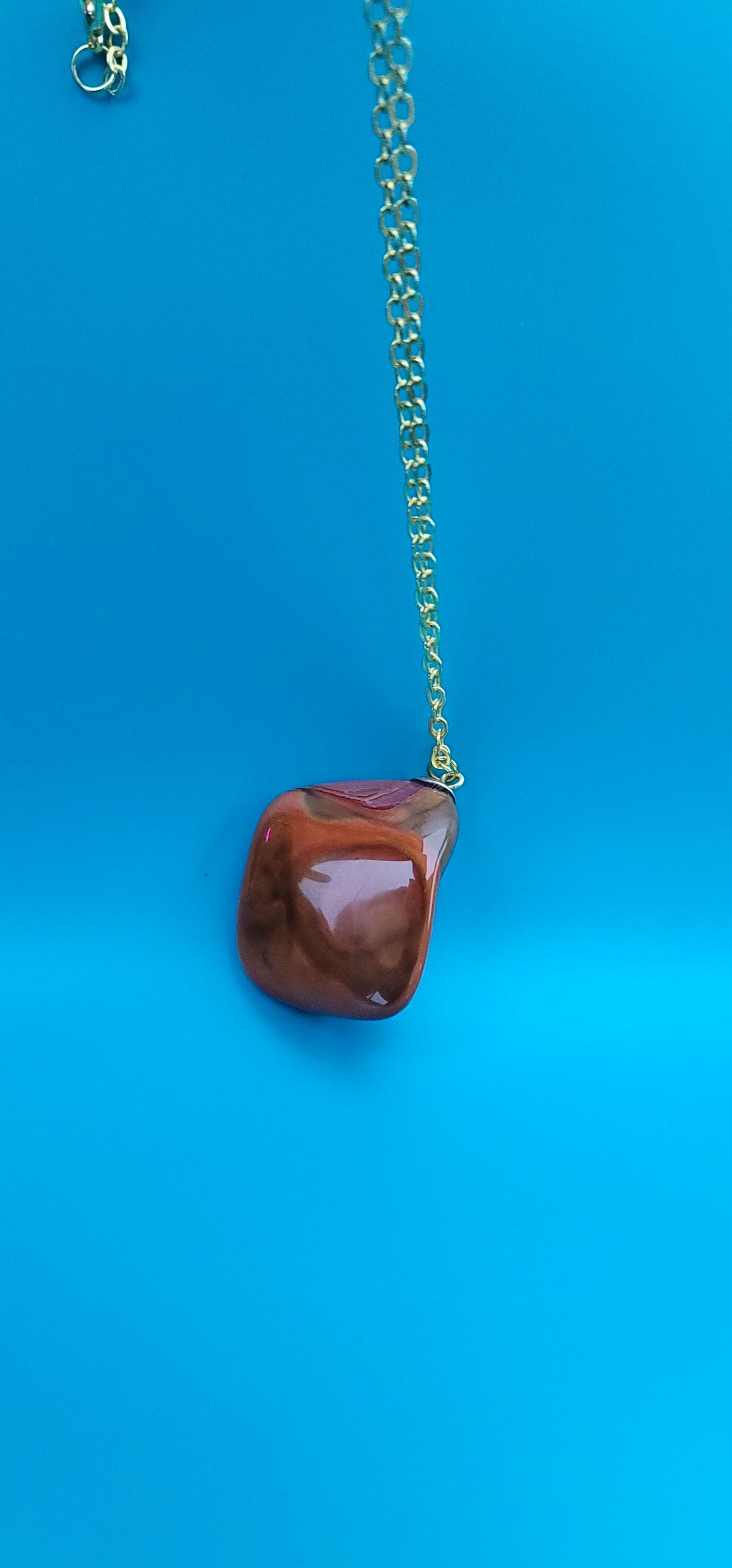 POLYCHROME JASPER PENDANT WITH A UNIQUE SHAPE AND INTRICATE COLOR PATTERN