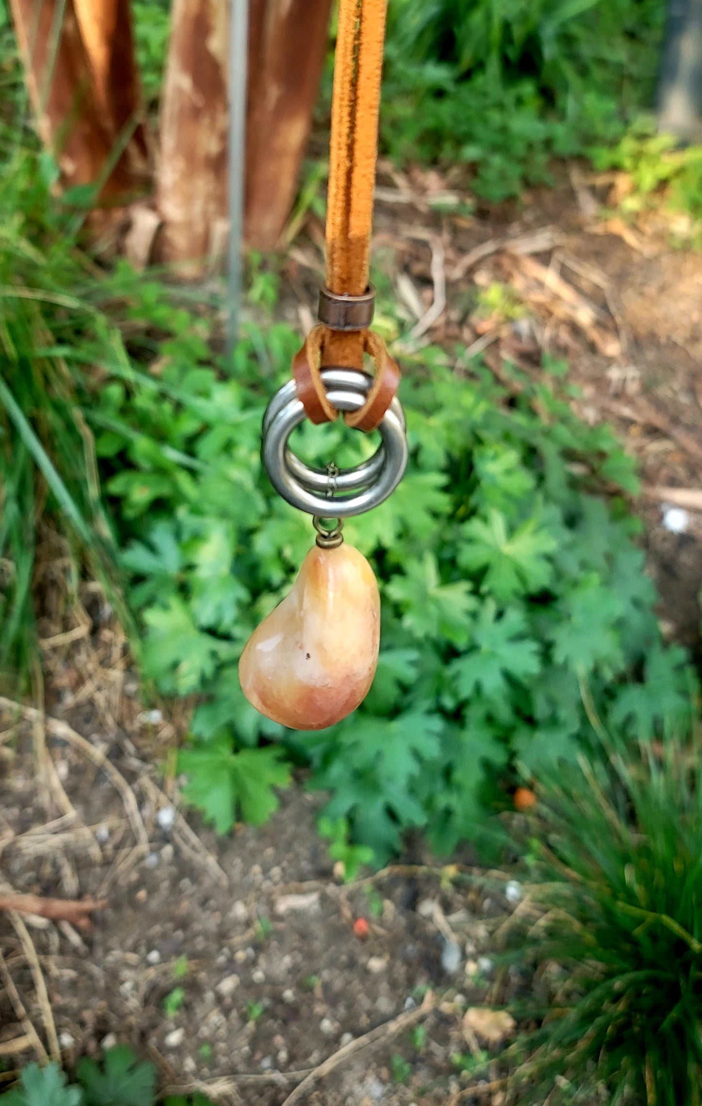 THIS BRASH AND BOLD AVENTURINE PENDANT IS LARGER THAN LIFE.