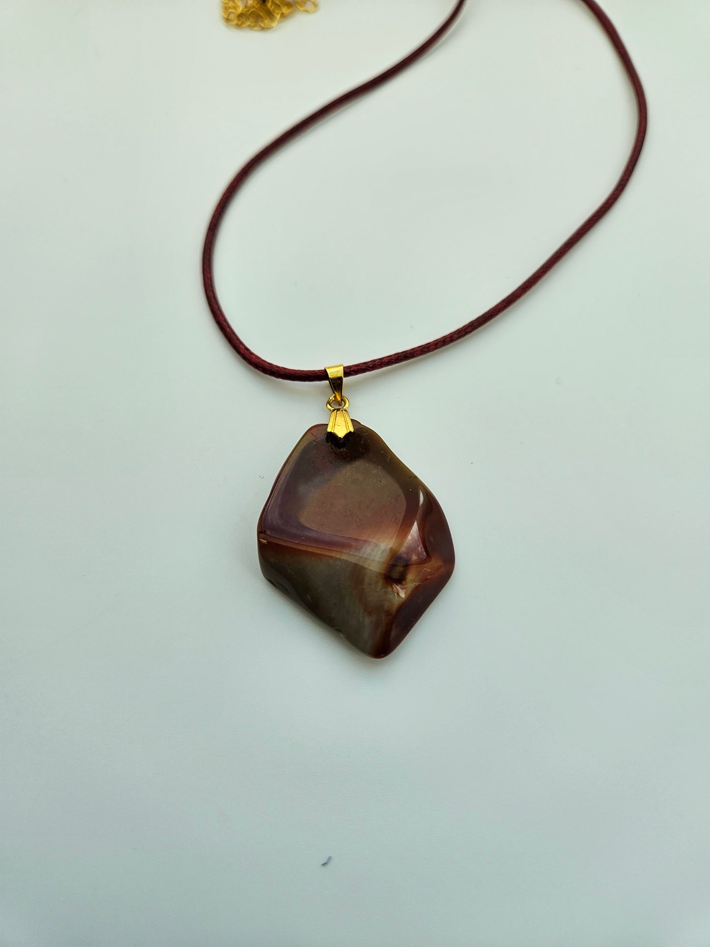 AN EXQUISITE DESERT JASPER PENDANT that is super unique in shape and color. Be amazed by the Uniqueness of this Pendant. You are sure to be the center of the conversation with this piece!!