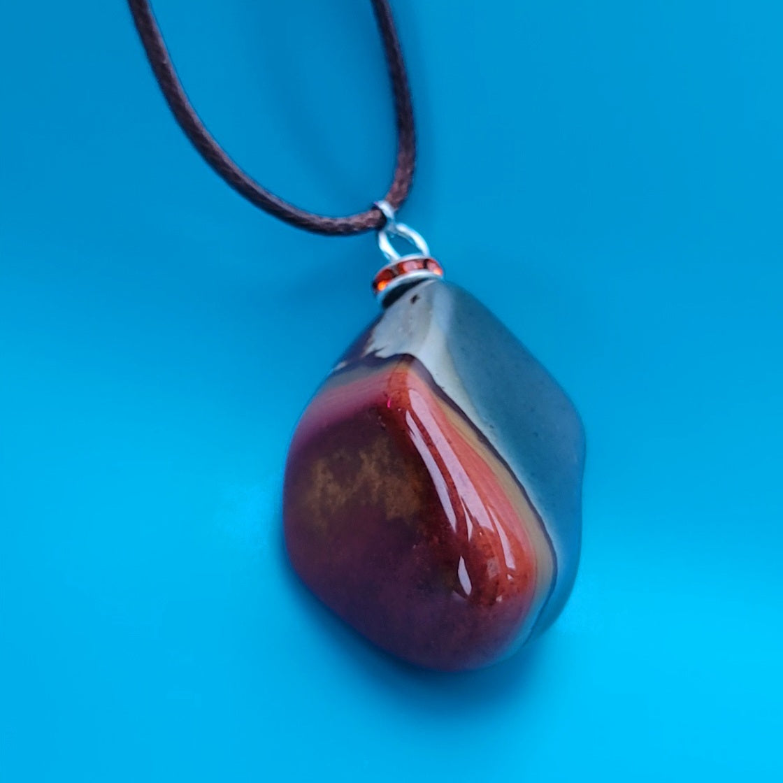 BEAUTIFUL POLYCHROME JASPER PENDANT WITH A STUNNING ARRAY OF COLOR PATTERNS.