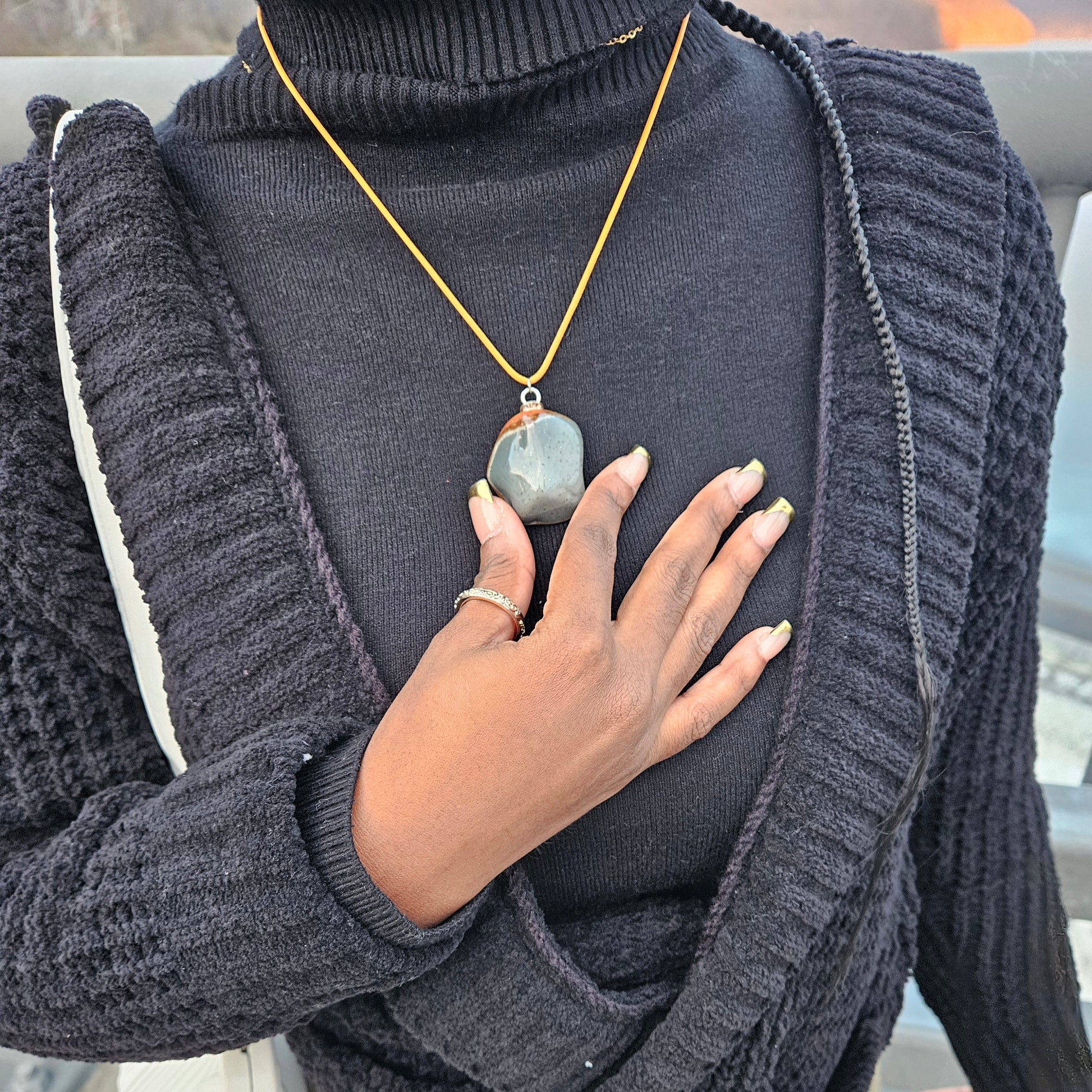 Unique and bold Desert Jasper Pendant with a very intricate color pattern. You will be amazed by its stunning beauty. It is finished with a Yellow Polyester string.