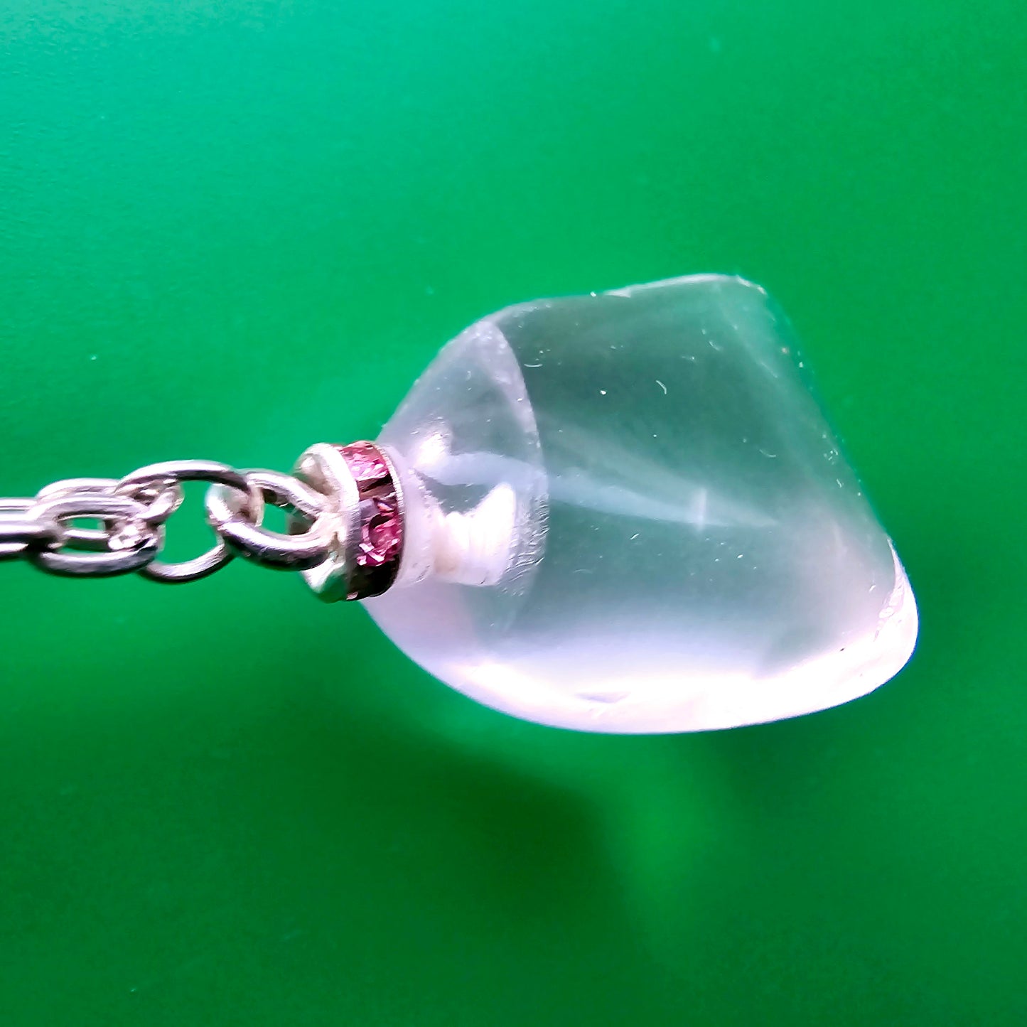 Unique Clear Quartz Pendant that is finished with a 20" Silver-plated chain.