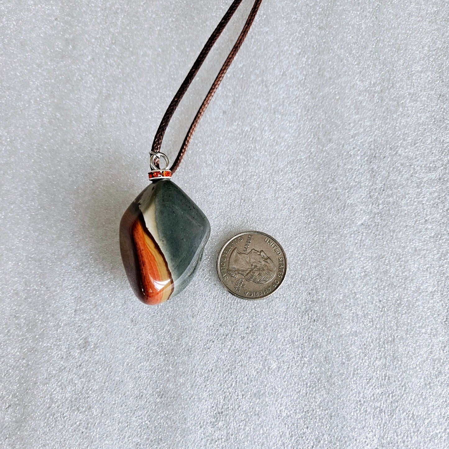 BEAUTIFUL POLYCHROME JASPER PENDANT WITH A STUNNING ARRAY OF COLOR PATTERNS.