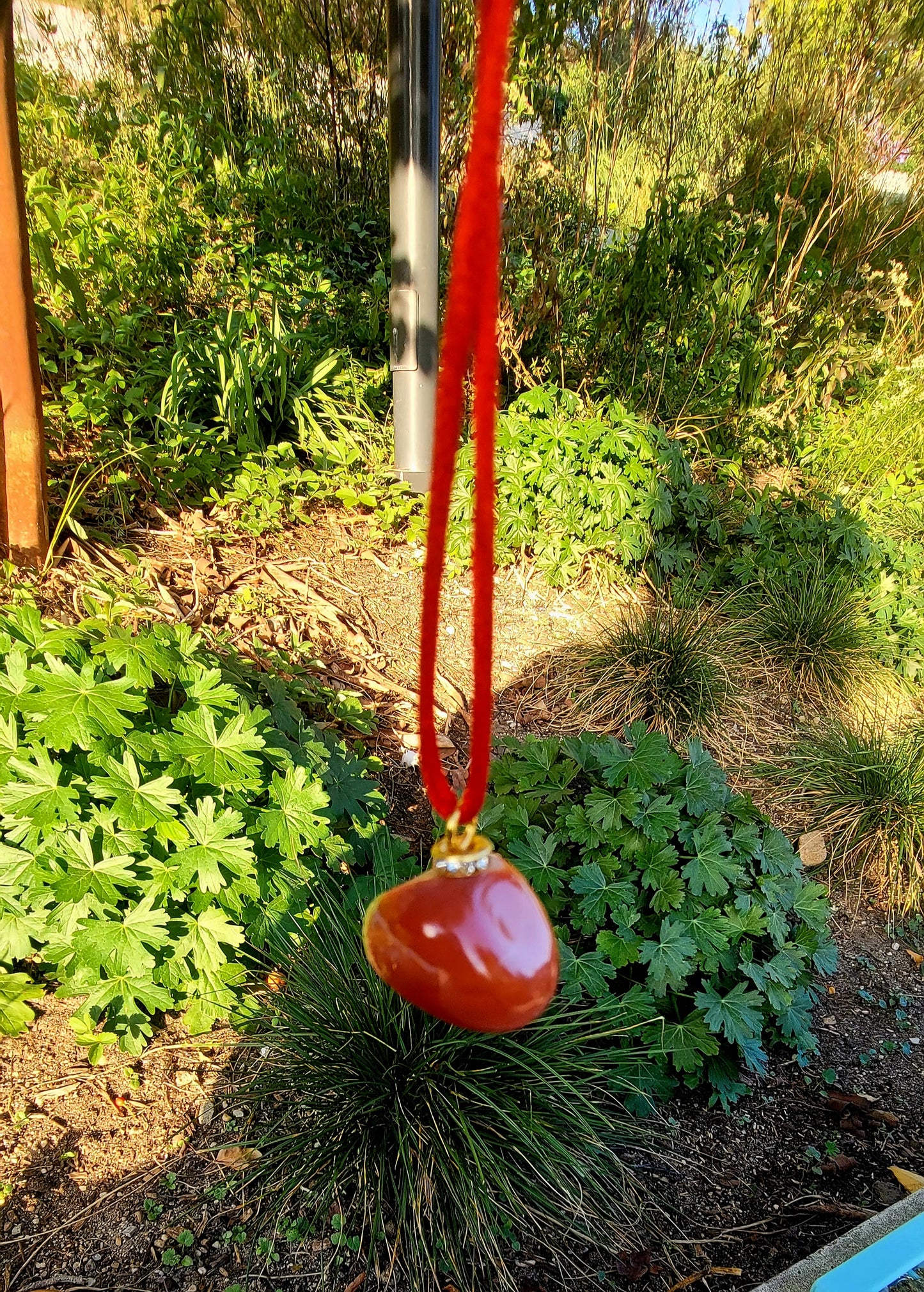 THIS INTRIGUING CARNELIAN AGATE PENDANT WILL FILL YOU WITH CURIOUSITY AND AWE.