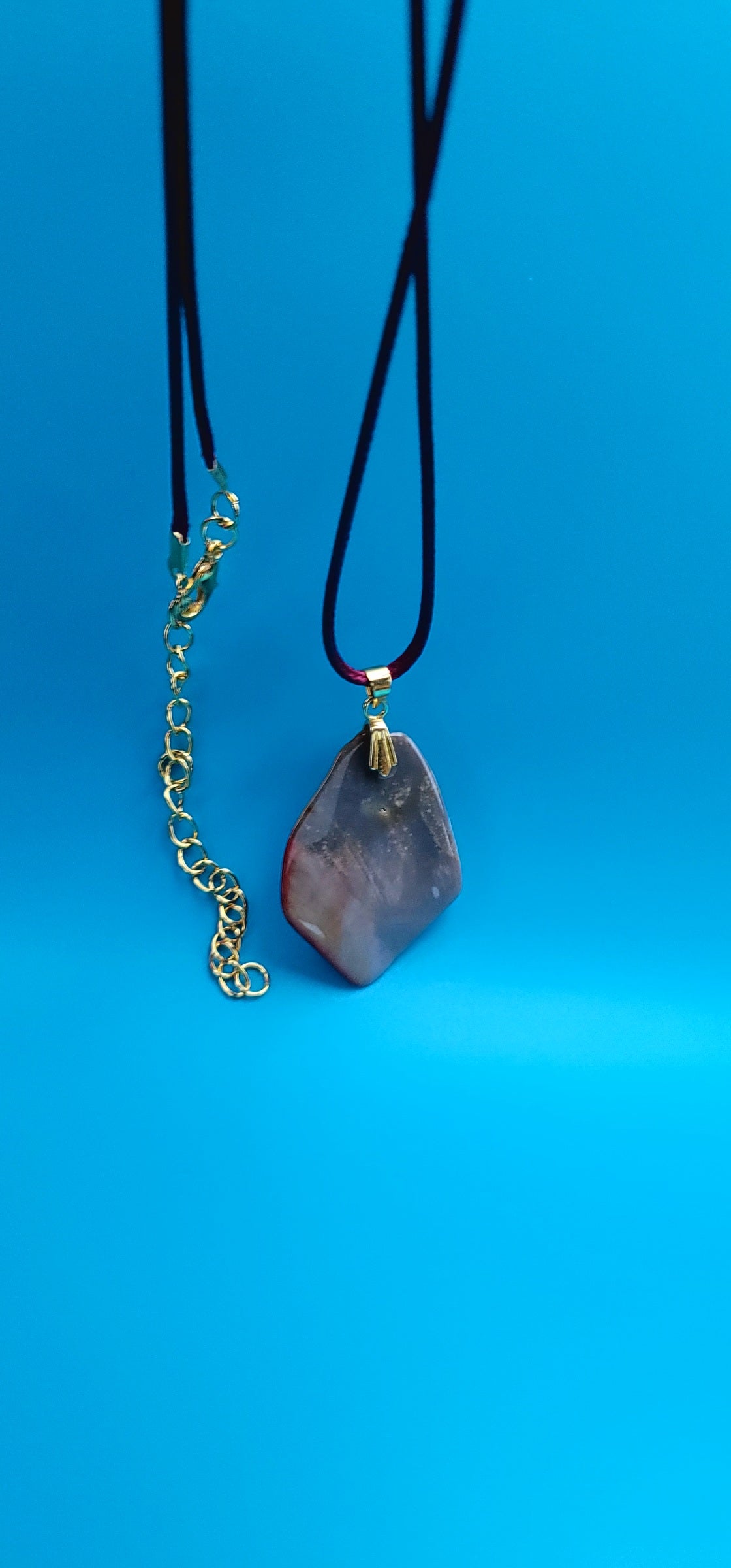 AN EXQUISITE DESERT JASPER PENDANT that is super unique in shape and color. Be amazed by the Uniqueness of this Pendant. You are sure to be the center of the conversation with this piece!!