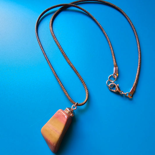 Very vibrant and colorful Jasper pendant that's trimmed with copper findings and an 18" Polyester string.