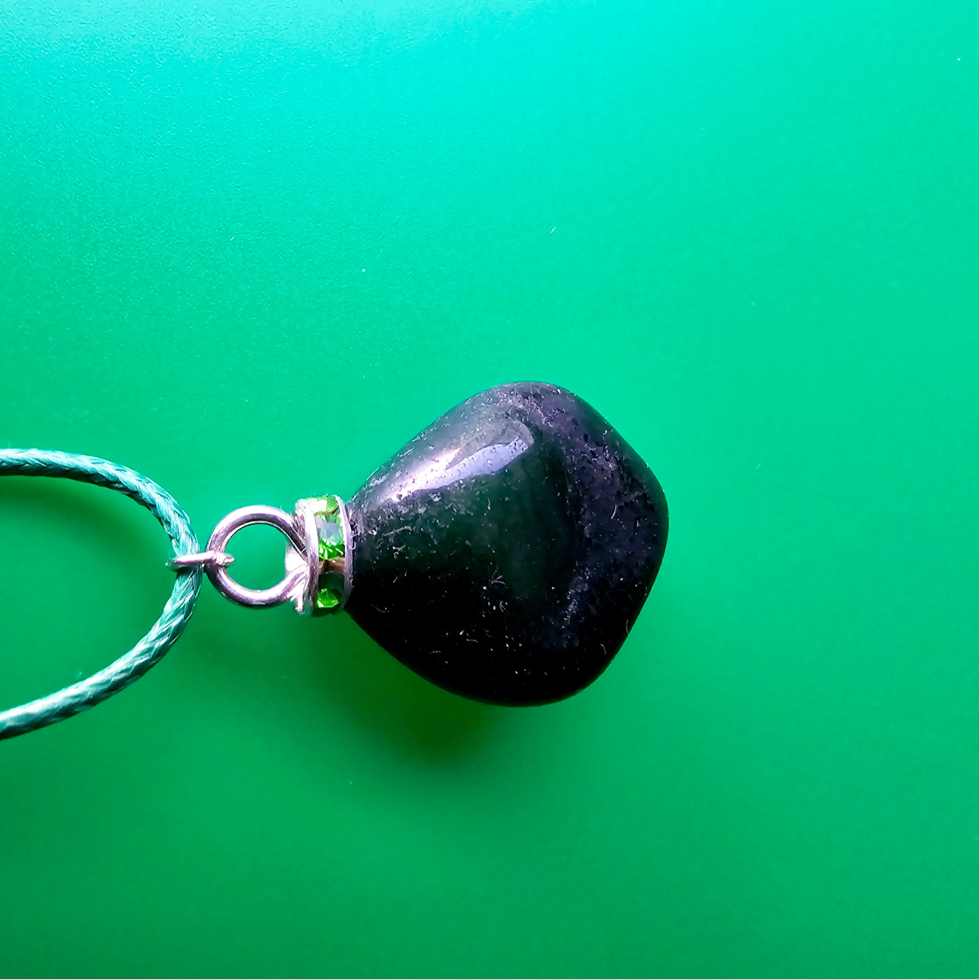 Cute Green Jasper Pendant, trimmed with Plated-Silver findings and an 18" green Polyester string.