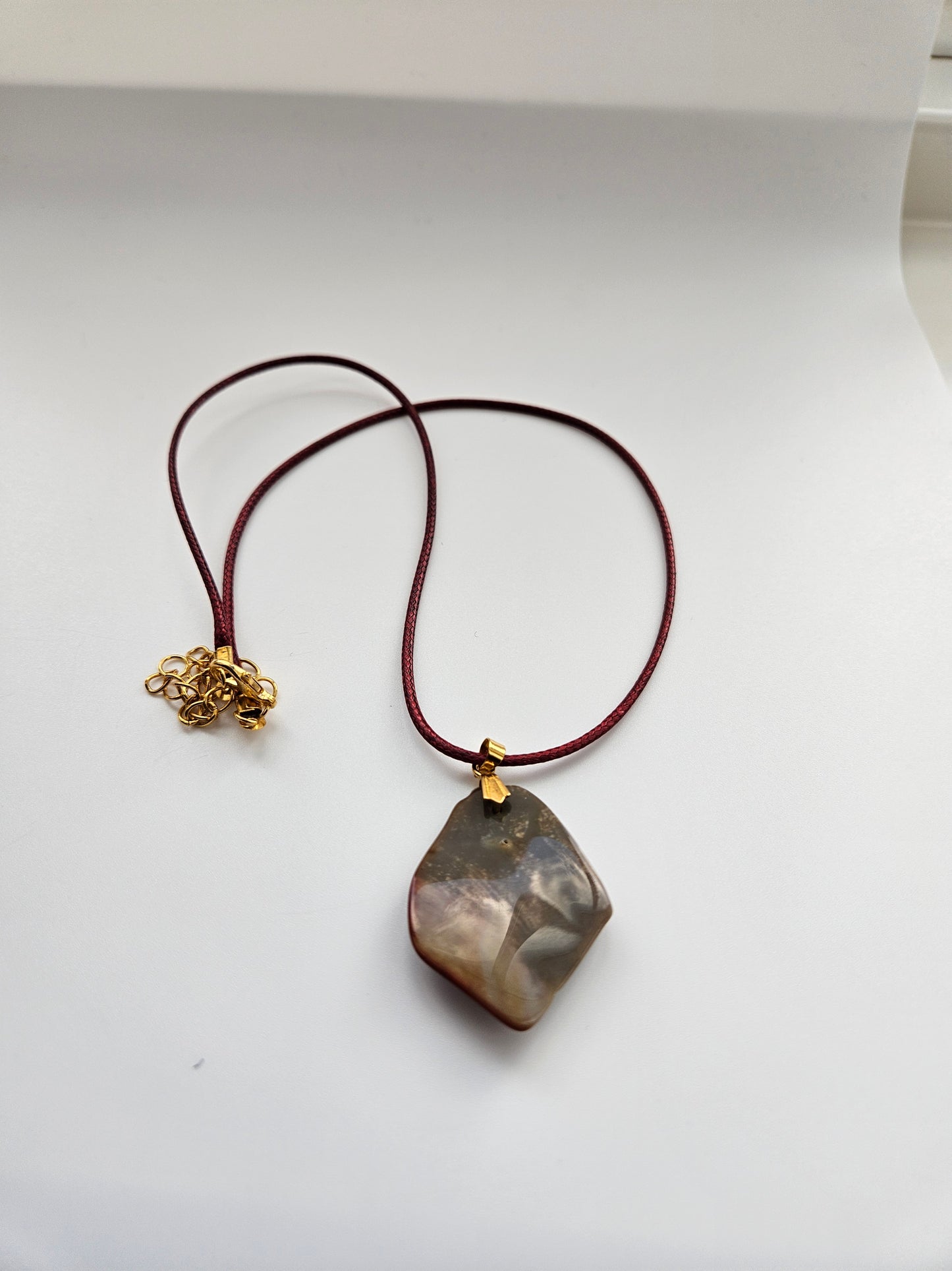 AN EXQUISITE DESERT JASPER PENDANT that is super unique in shape and color. Be amazed by the Uniqueness of this Pendant. You are sure to be the center of the conversation with this piece!!