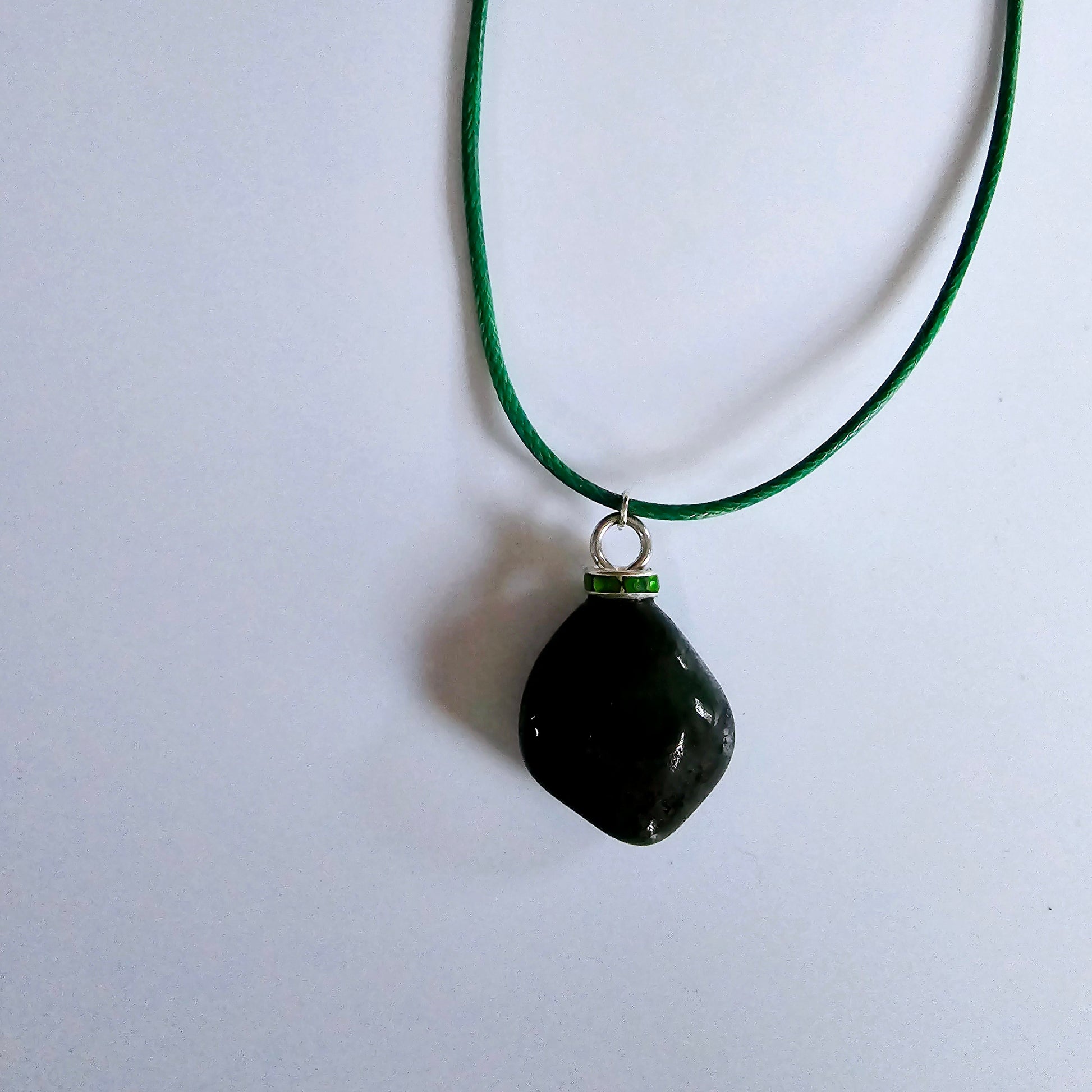 Cute Green Jasper Pendant, trimmed with Plated-Silver findings and an 18" green Polyester string.