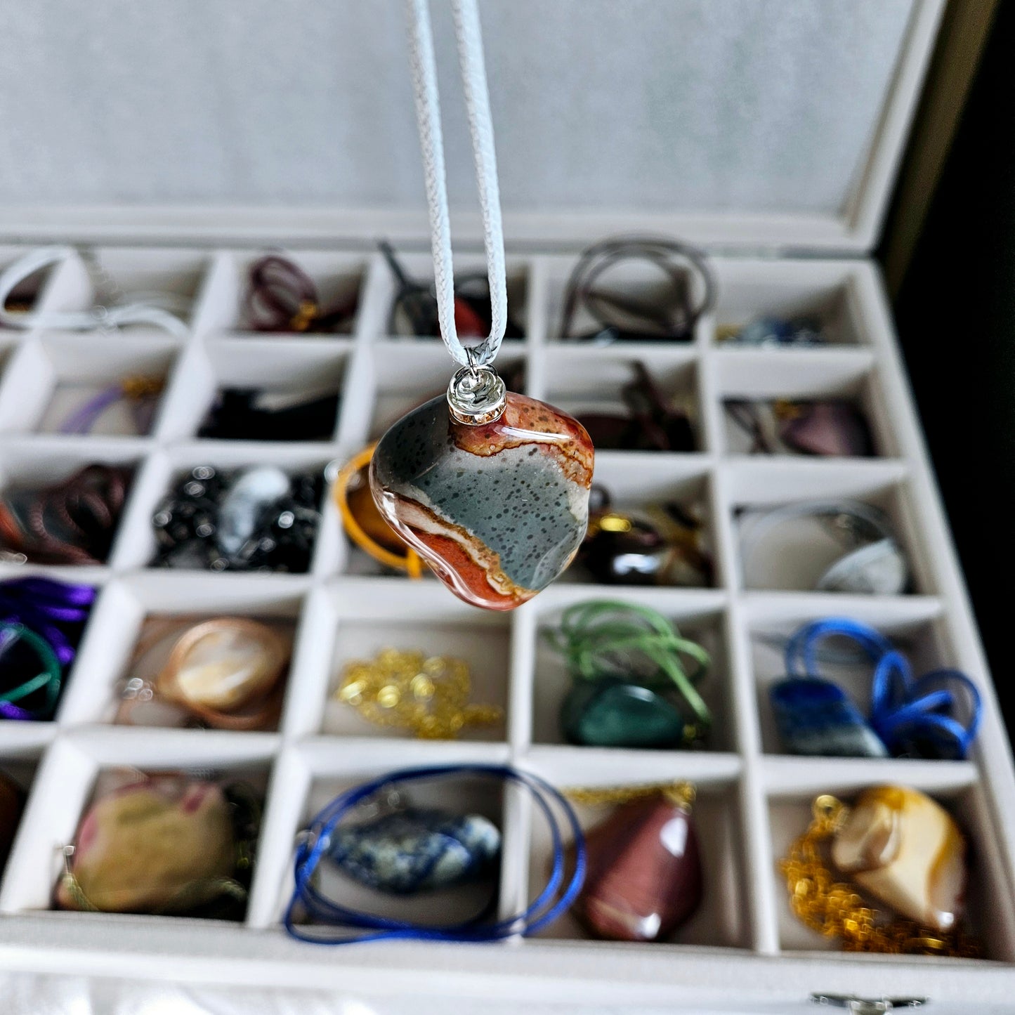 AMAZING DESERT JASPER PENDANT with extremely intricate color patterns and details! This is a very intricate and mesmerizing piece, featuring amazing color patterns and design. The shape is also super unique and will definitely stand out in the crowd!