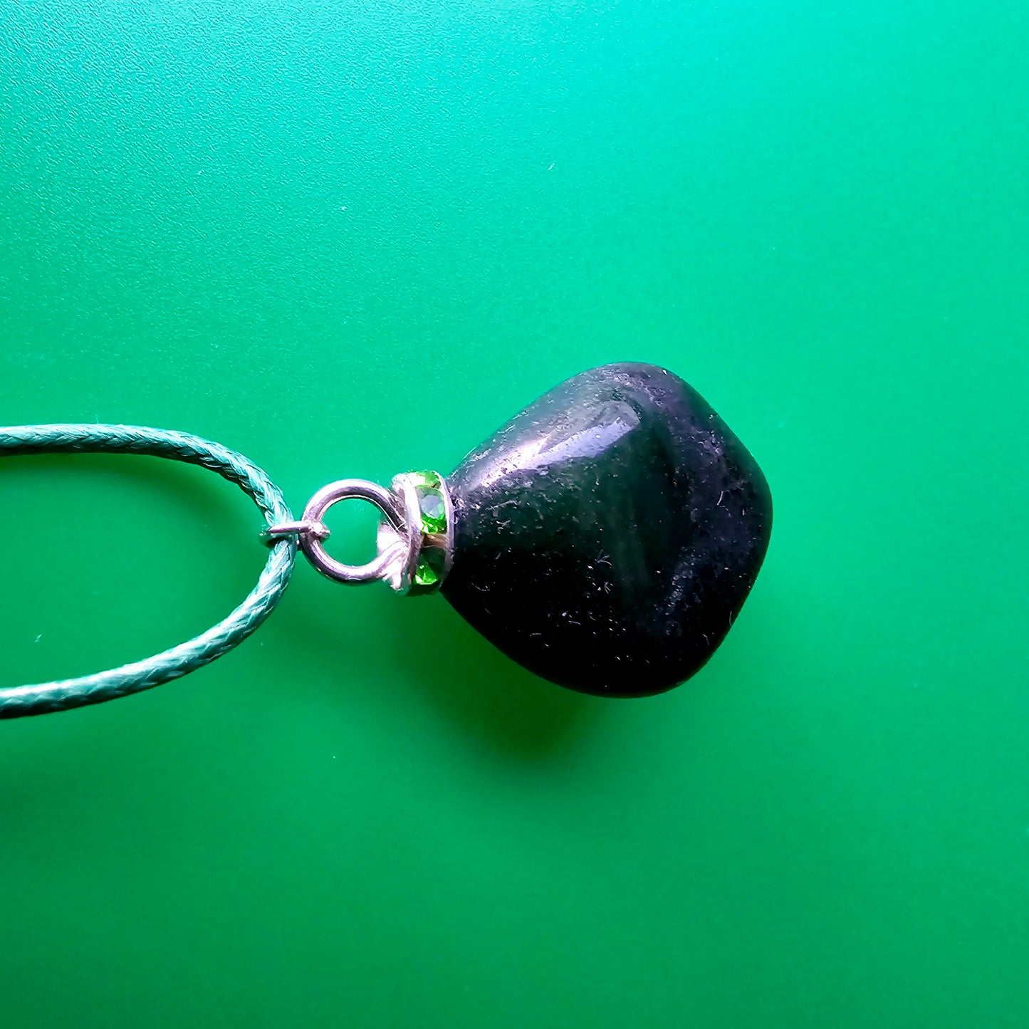 Cute Green Jasper Pendant, trimmed with Plated-Silver findings and an 18" green Polyester string.