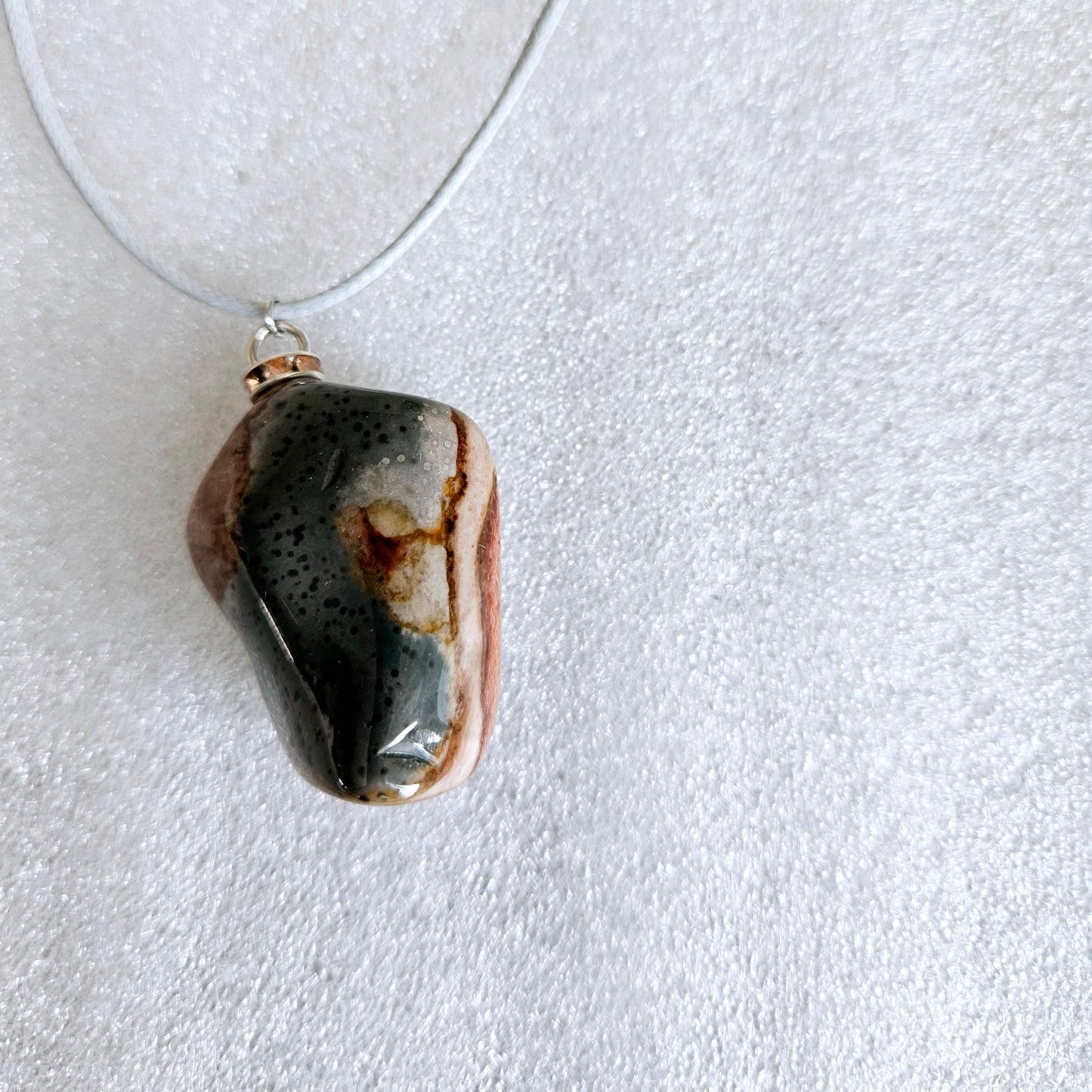 AMAZING DESERT JASPER PENDANT with extremely intricate color patterns and details! This is a very intricate and mesmerizing piece, featuring amazing color patterns and design. The shape is also super unique and will definitely stand out in the crowd!