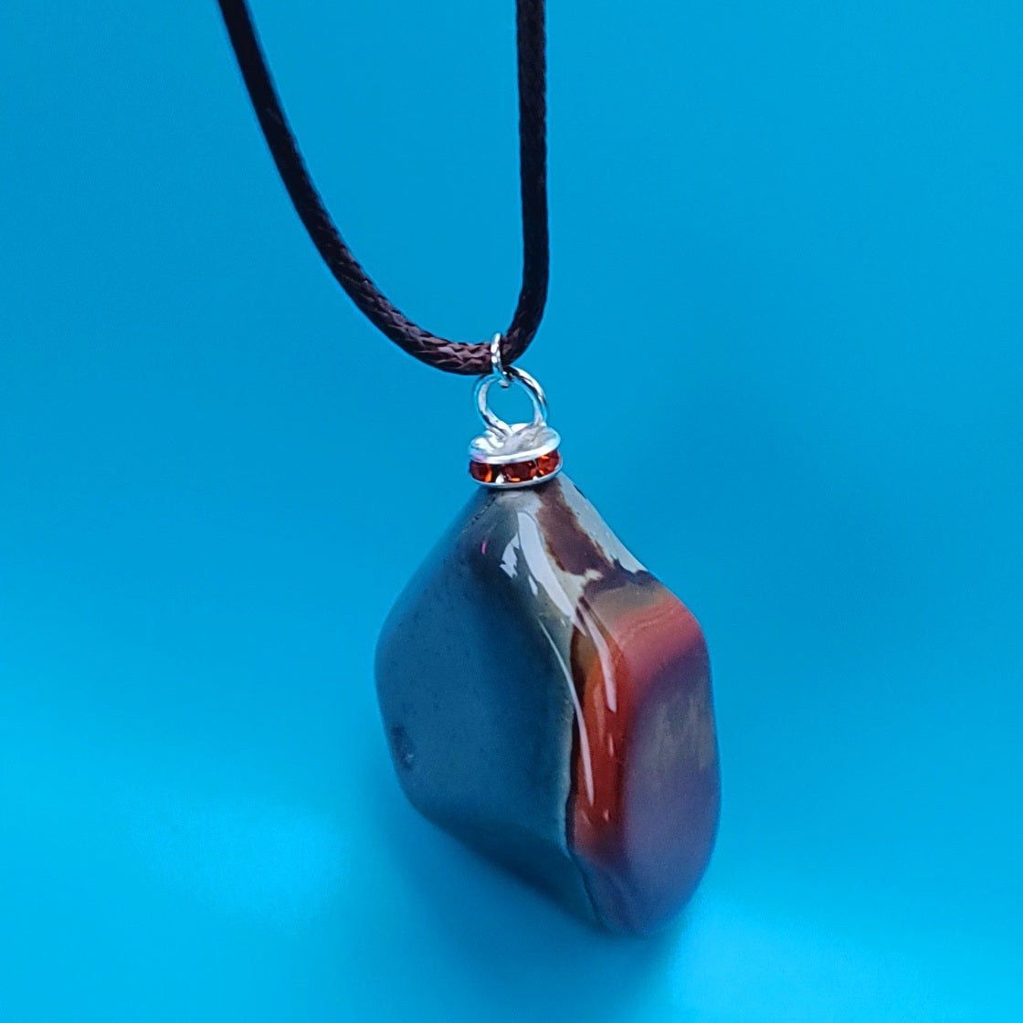 BEAUTIFUL POLYCHROME JASPER PENDANT WITH A STUNNING ARRAY OF COLOR PATTERNS.