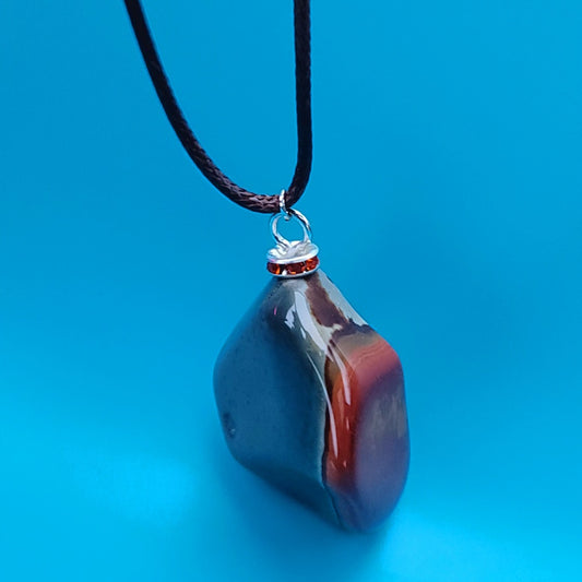 BEAUTIFUL POLYCHROME JASPER PENDANT WITH A STUNNING ARRAY OF COLOR PATTERNS.