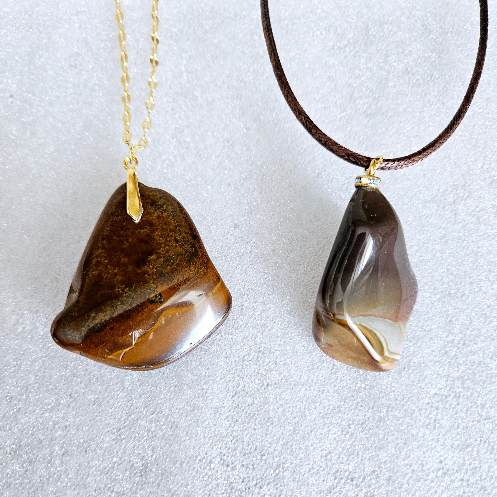 This bold desert jasper pendant is expertly crafted from stunning, natural jasper stone. Its unique, bold design exudes confidence and style, making it the perfect statement piece for any outfit